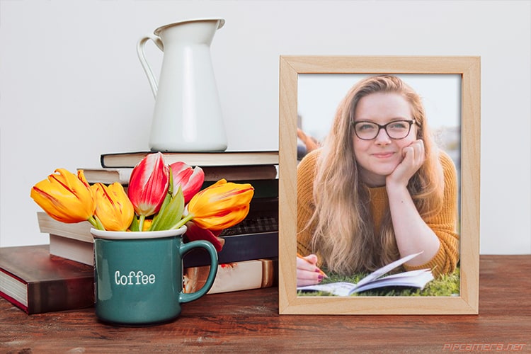 Photo Frame On Desk With Beautiful Flower